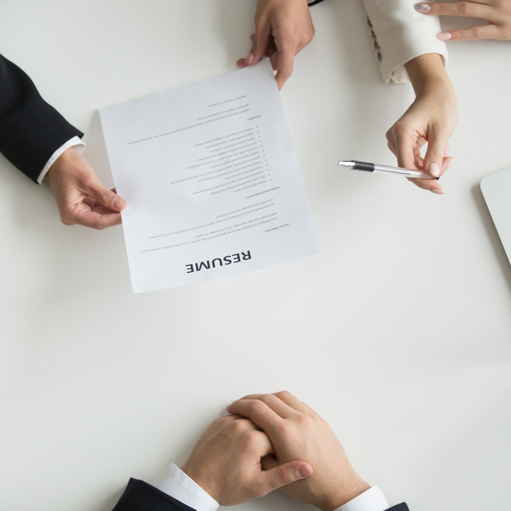 hr-reading-applicants-resume-job-interview-top-closeup-view